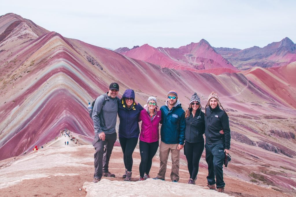 The rainbow mountains in Peru is one of the most beautiful places I've visited. The rainbow mountains photography I captured on our 1 day trek will inspire, and make it worth visiting the mountains. My itinerary provides what to wear, outfits, food, how to get there and more. | Her Life Adventures | #rainbow #mountains #peru #photography #outfit #beautiful #places #trek #travel #destinations #food #itinerary
