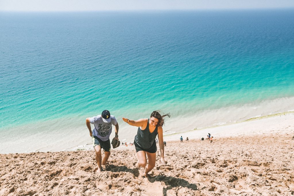 This Sleeping Bear Dunes itinerary covers the best of what to do on the National Lakeshore, how to get there and where to stay. Add this hidden gem to your summer bucket list. | Her Life Adventures | #camping #usdestinations #travelhacks #travelguide #adventuretravel #roadtrip #nationalpark #nationalparkroadtrip #michigantravel #greatlakes #ustravel #summer #bucketlist #sleepingbear #lakemichigan #sanddunes