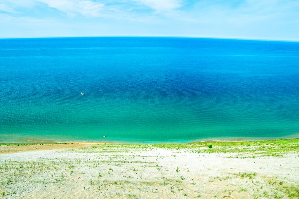 This Sleeping Bear Dunes itinerary covers the best of what to do on the National Lakeshore, how to get there and where to stay. Add this hidden gem to your summer bucket list. | Her Life Adventures | #camping #usdestinations #travelhacks #travelguide #adventuretravel #roadtrip #nationalpark #nationalparkroadtrip #michigantravel #greatlakes #ustravel #summer #bucketlist #sleepingbear #lakemichigan #sanddunes