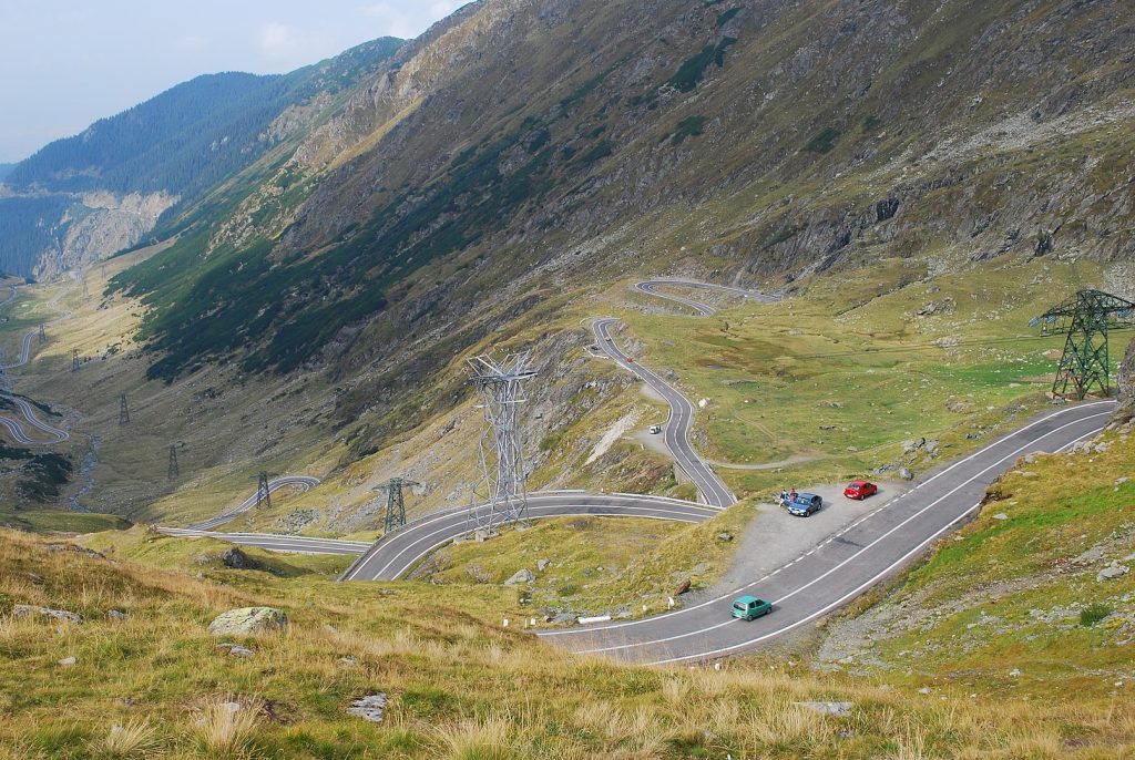 9 Global Mountain Passes That Turn Driving Into an Expedition – Her Life Adventures Romanian Highway in Hilly Area