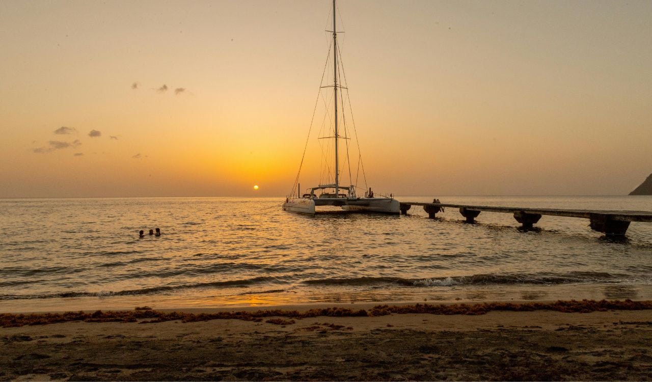 Yacht Moored on Sea Shore at Sunset