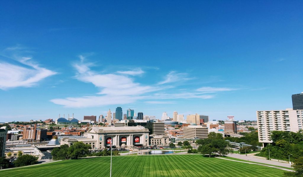 12 U.S. City Breaks That Feel Big Without A Big Budget – Her Life Adventures Grass Field Beside Building Structures