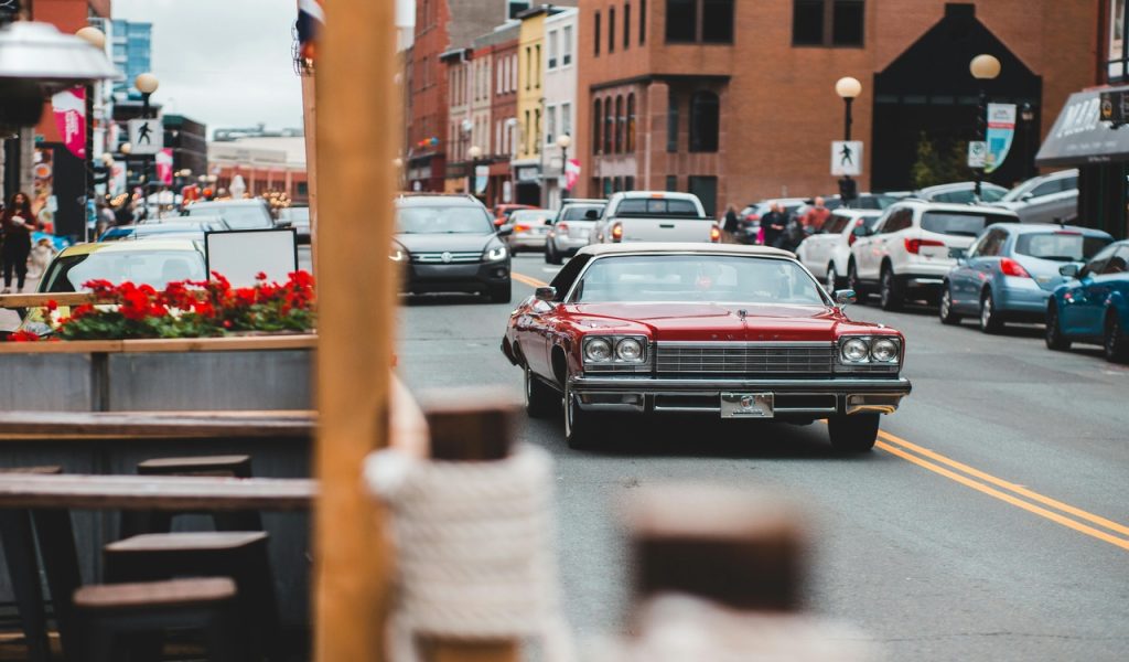 12 U.S. City Breaks That Feel Big Without A Big Budget – Her Life Adventures Old fashioned car on road near aged buildings