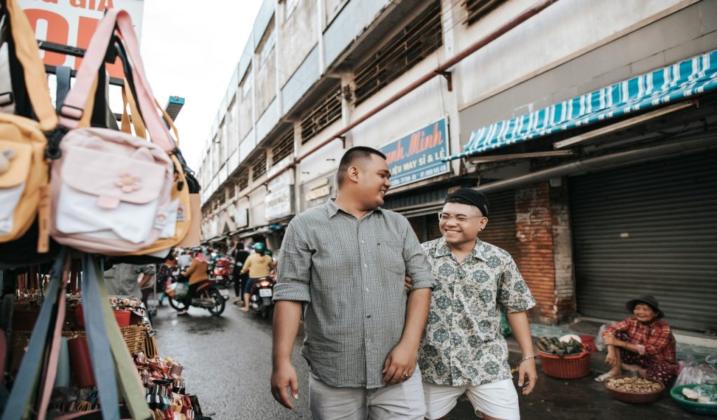 Men Walking on a Street Market
