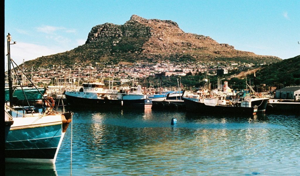 15 Bucket-List Destinations Frequent Travelers Love – Her Life Adventures Scenic View of Hout Bay Harbor with Boats