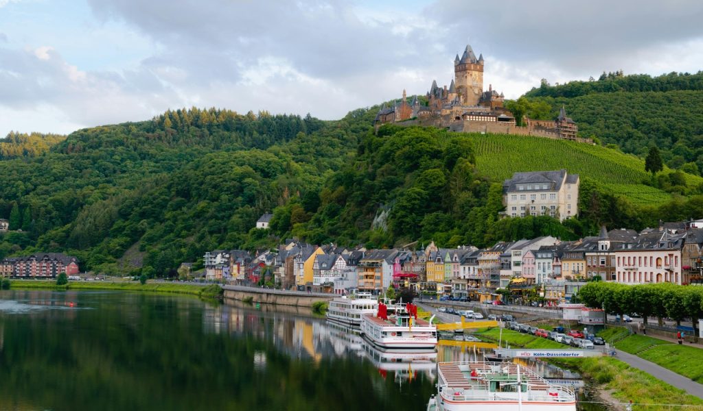 Why Inclusive River Cruises Are Becoming The Easiest Way To See Europe – Her Life Adventures Castle on Hill over Village Near Body of Water