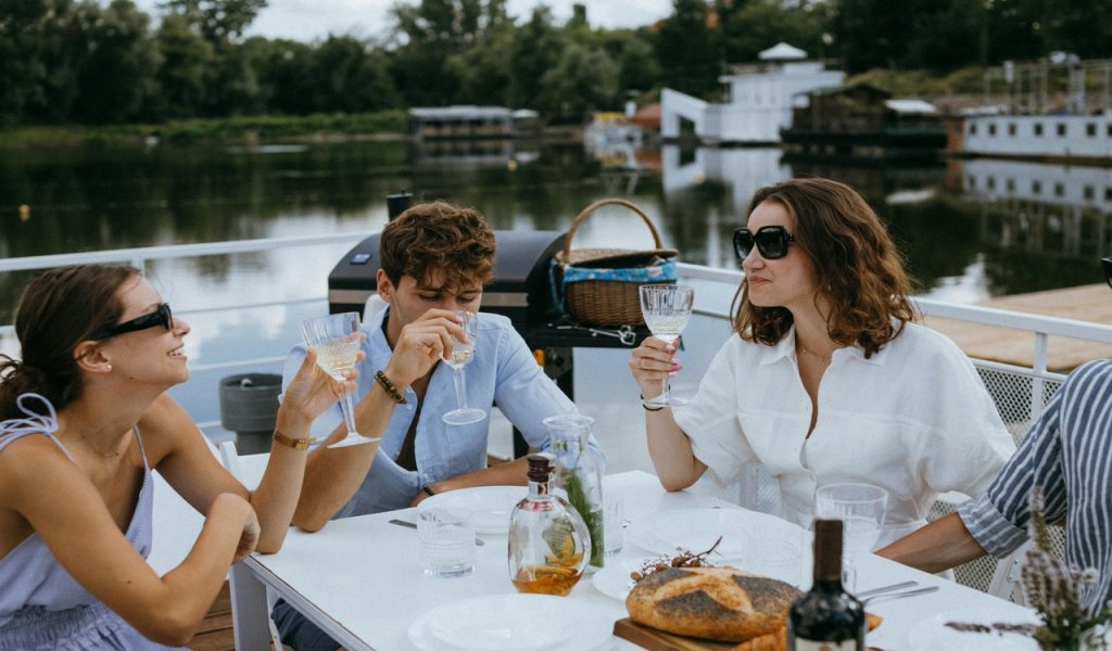 Why Inclusive River Cruises Are Becoming The Easiest Way To See Europe – Her Life Adventures Friends Drinking Champagne on a Yacht