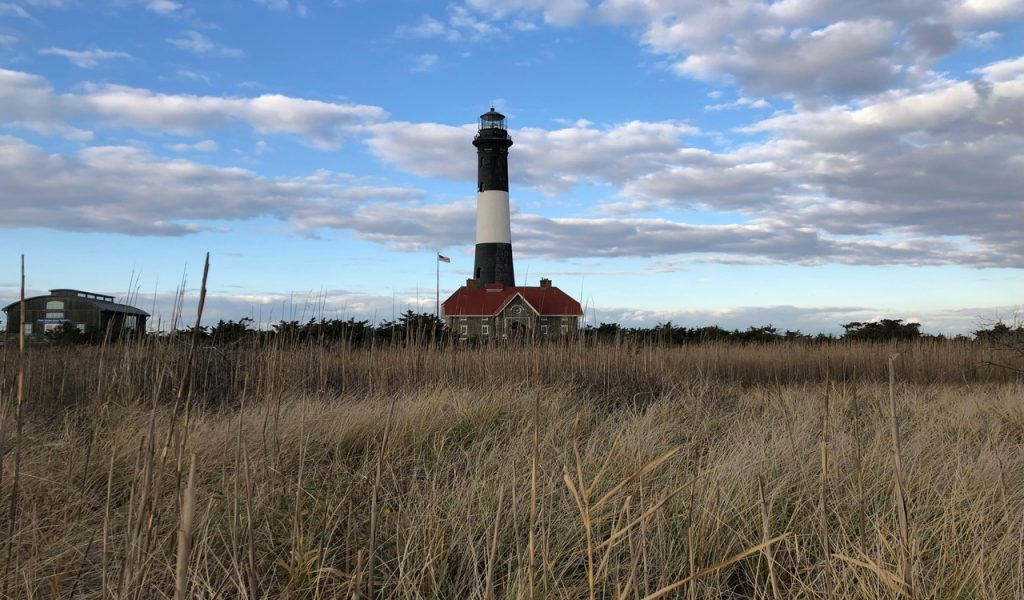 13 U.S. Islands You Can Reach By Ferry For Easy Weekend Escapes – Her Life Adventures Field Near a Lighthouse