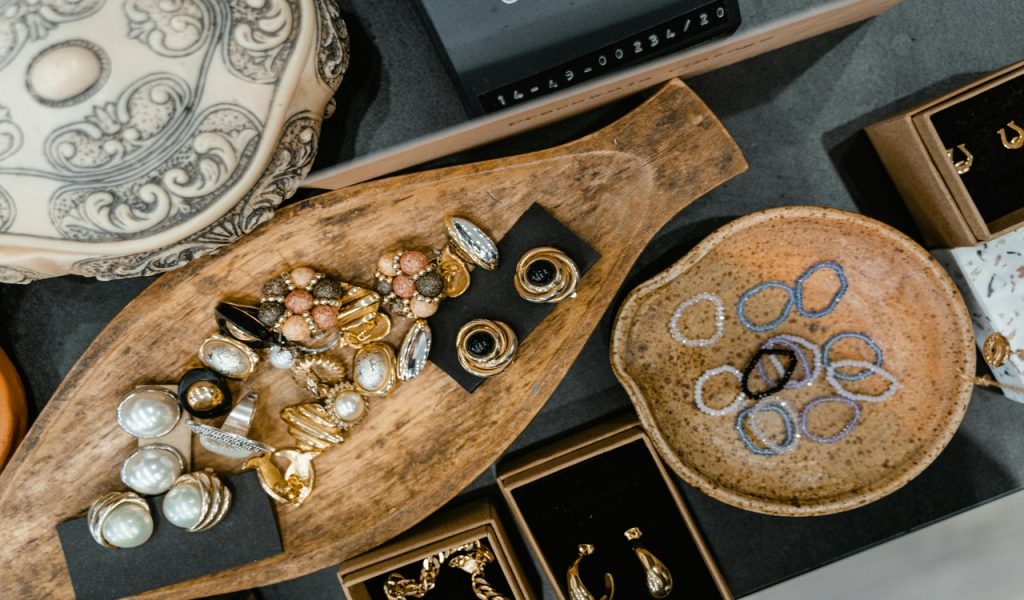 Gemstones and Jewelries on a Wooden Tray