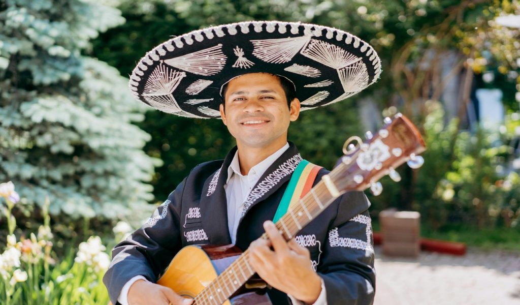 A Guitarist Wearing a Charro and a Sombrero