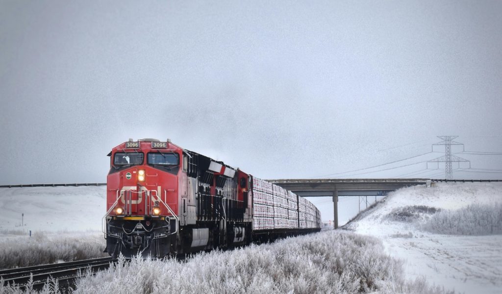 9 Countries With the Most Stunning Train Journeys – Her Life Adventures Red Train on Snow Covered Ground
