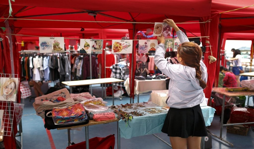 8 State Fairs with Big October Weekends – Her Life Adventures Woman Inside Booth