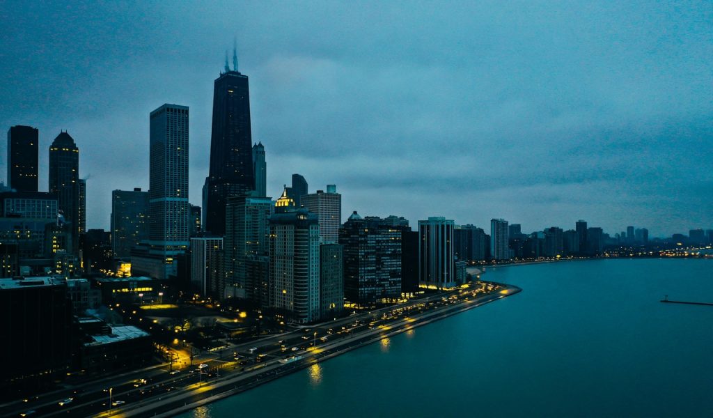 Scenic View Of City Under Cloudy Sky