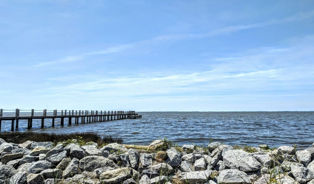 Brown Wooden Dock Near Gray Rocks