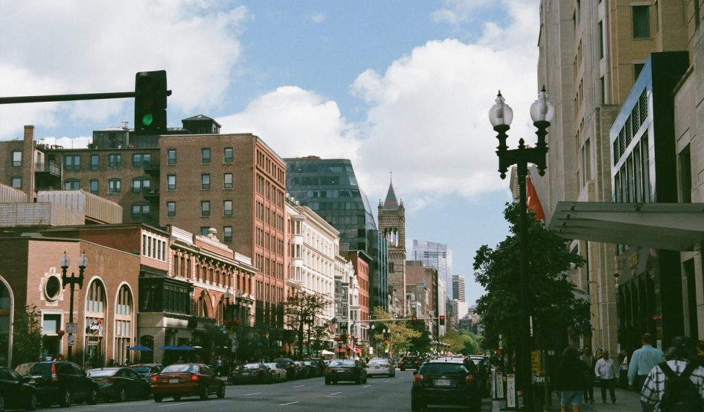 14 Weekend Road Trips Under 300 Miles From Major U.S. Hubs – Her Life Adventures Vehicles In The Middle Of The Street Surrounded With Buildings