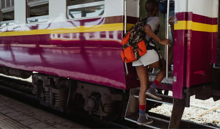 Woman Walking Into a Train