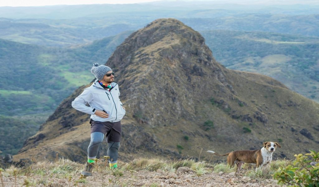 Hiker and Dog on Mountain Trail in Costa Rica