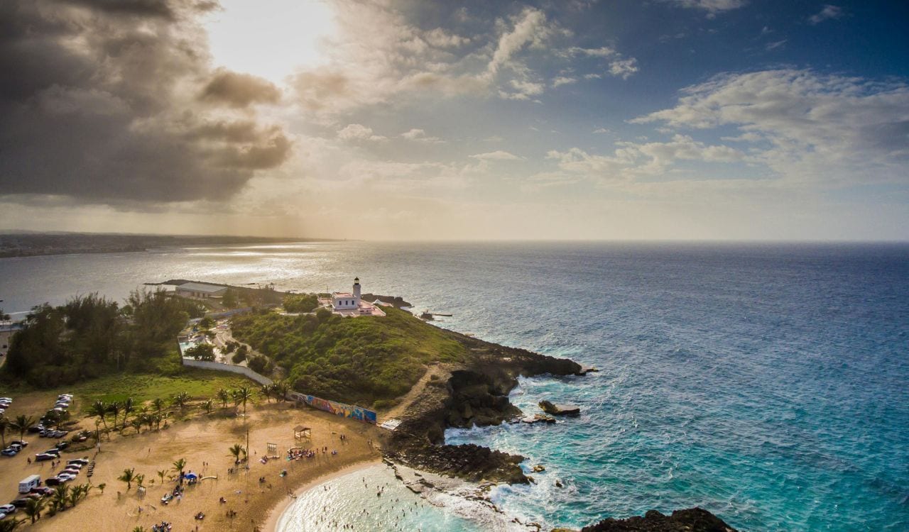 Island and Ocean Under A Cloudy Sky