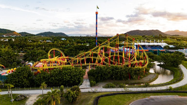 Aerial View of Roller Coaster in Tropical Theme Park