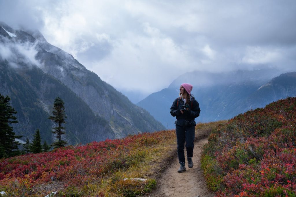 Woman Hiking on Scenic Mountain Trail