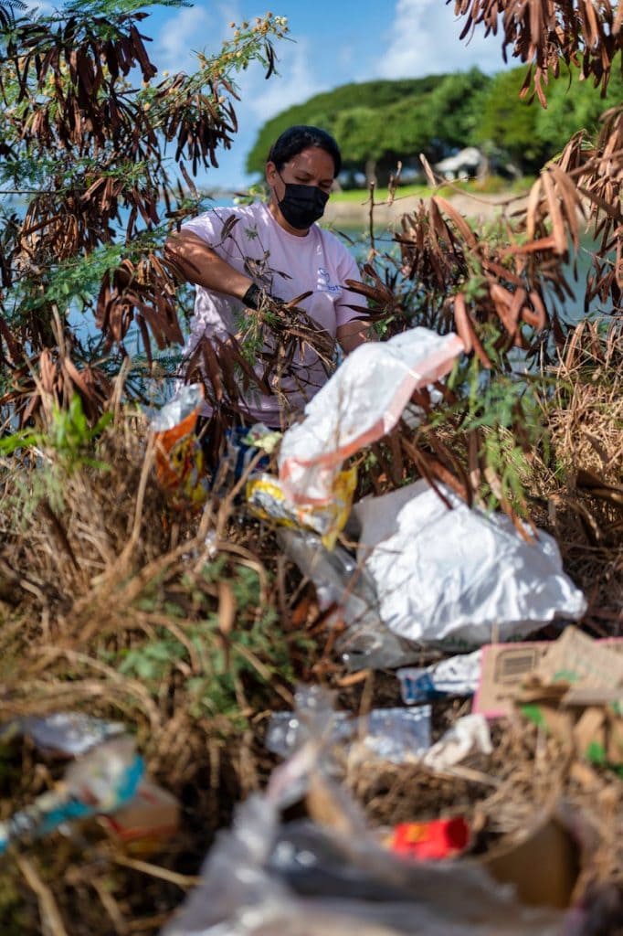 A Person Collecting Left Trash Behind