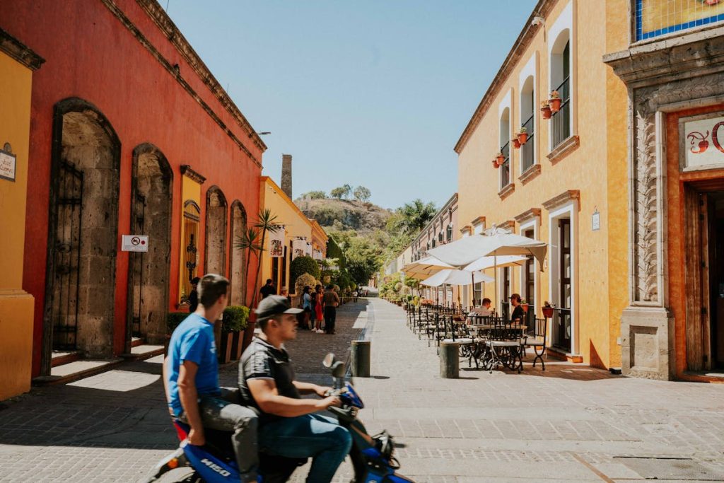 10 Real Ways to Help Wildlife in South America on Your Next Trip – Her Life Adventures Men Riding on a Motor Scooter in an Alley between Buildings