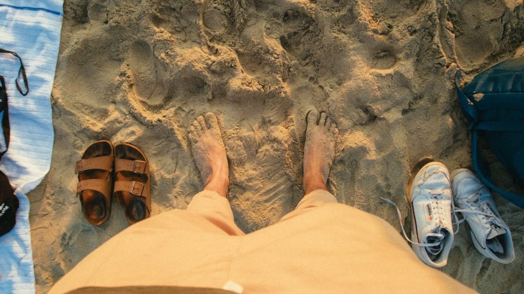 8 Travel Gear Items To Leave At Home For October Trips – Her Life Adventures A Person Standing on a Beach
