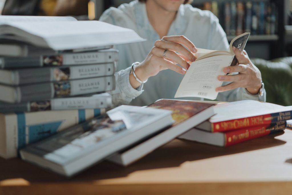 Woman in White Robe Reading Book