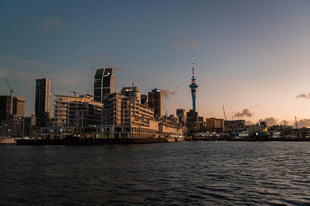 10 Countries With Rising Trip Costs And How To Budget For Them – Her Life Adventures Photo of Auckland City at Dusk, New Zealand