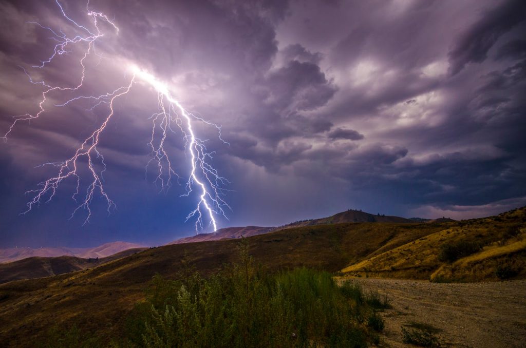 Lightning striking distant peaks