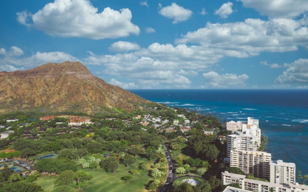 Scenic Landscape with a Coastal City against a Cloudy Sky
