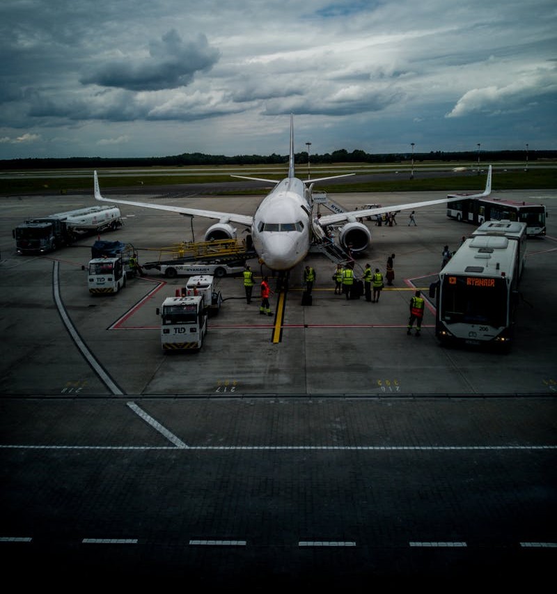 Airplane at Airport Terminal During Overcast Day