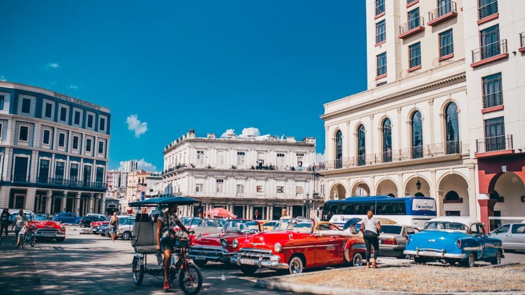 Parked Vehicles Near Building in Cuba