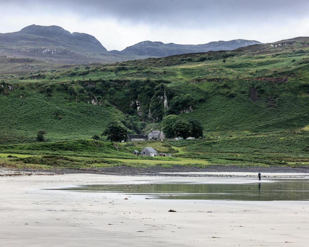 Scenic Landscape of Isle of Eigg Beach and Hills
