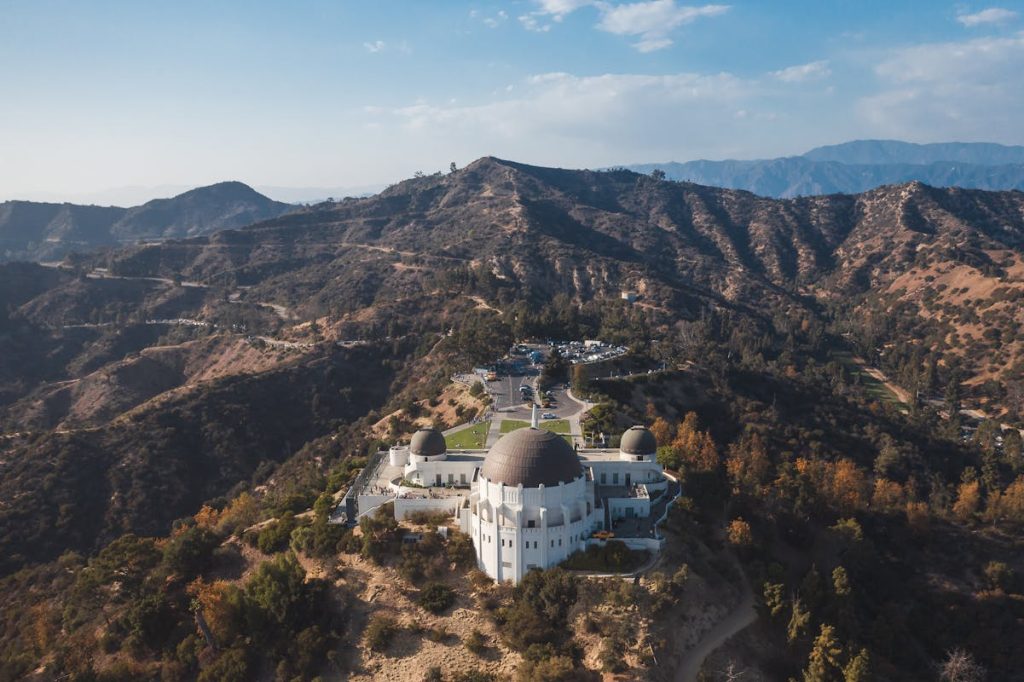 9 American Film Locations Where Travelers Can Relive Iconic Scenes – Her Life Adventures An Aerial Shot of the Griffith Observatory in California