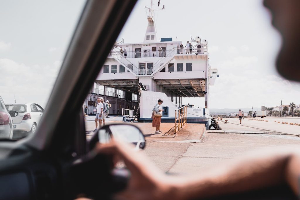 People by the Pier near Ship Vessel