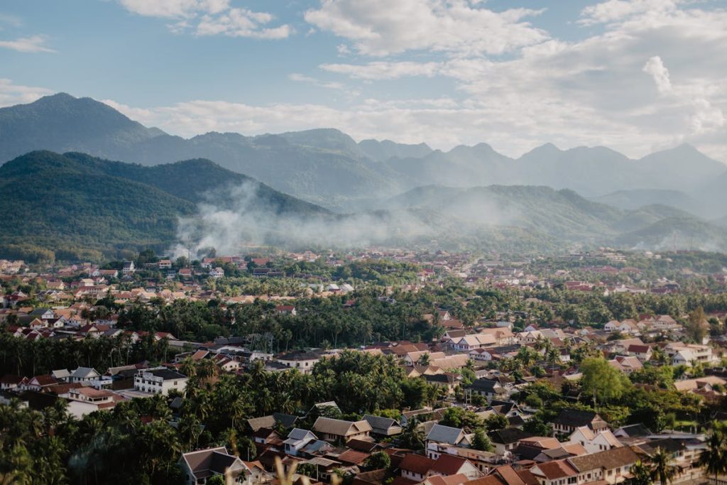 Picturesque view of village in valley near mountains