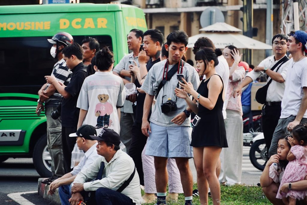 Tourists wearing casual, comfortable clothes in a mixed crowd abroad.