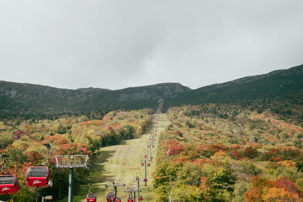 Scenic Autumn Gondola Ride in Mountain Landscape
