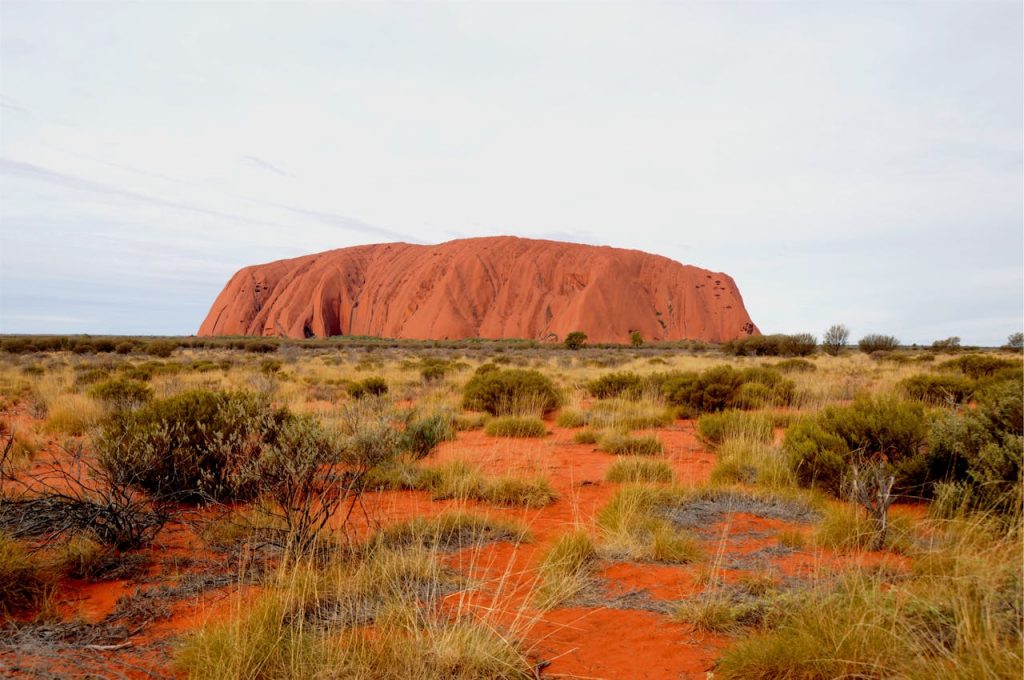 7 Places Around the World Where Sunrise Is Considered Sacred – Her Life Adventures Uluru in the Australian Outback Landscape