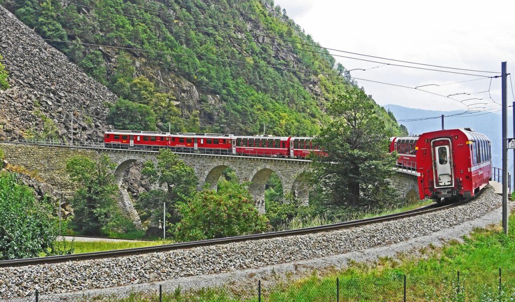 9 Countries With the Most Stunning Train Journeys – Her Life Adventures Red Train on Black Steel Train Rail during Day