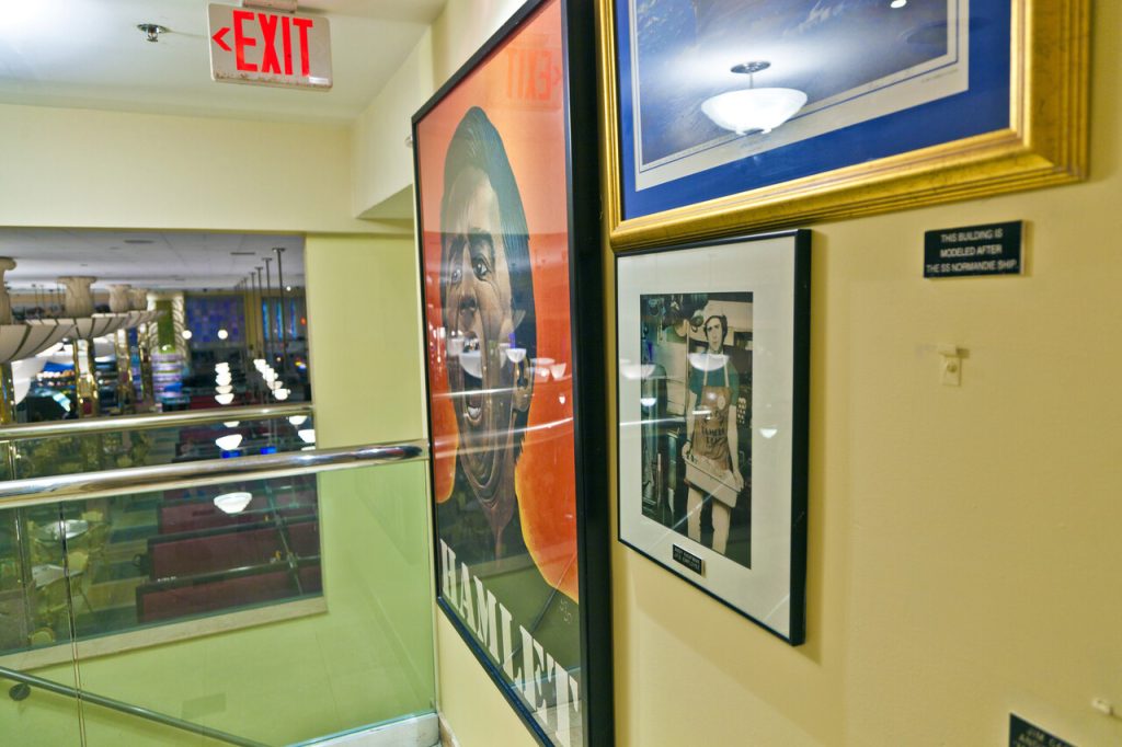 A small theater with indie film posters lining 