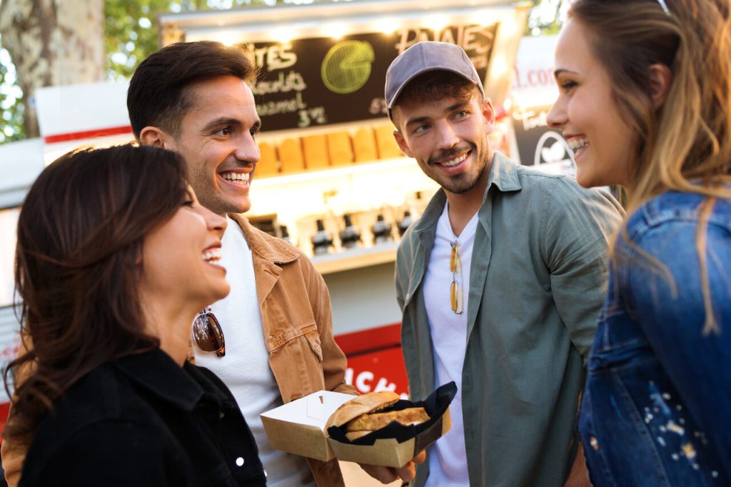 A small group of travelers chatting at a local market