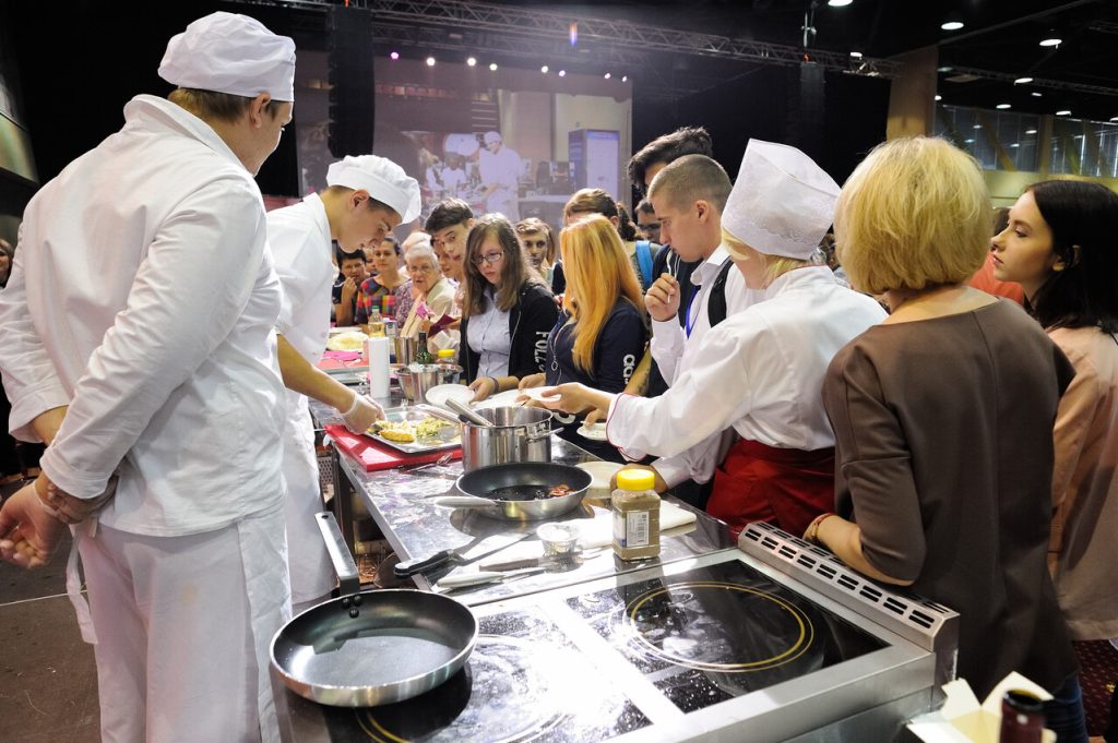Tourists and locals participating in a cooking class,