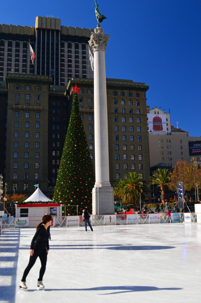 A young woman ice skates during the Christmas season in Union Square in San Francisco