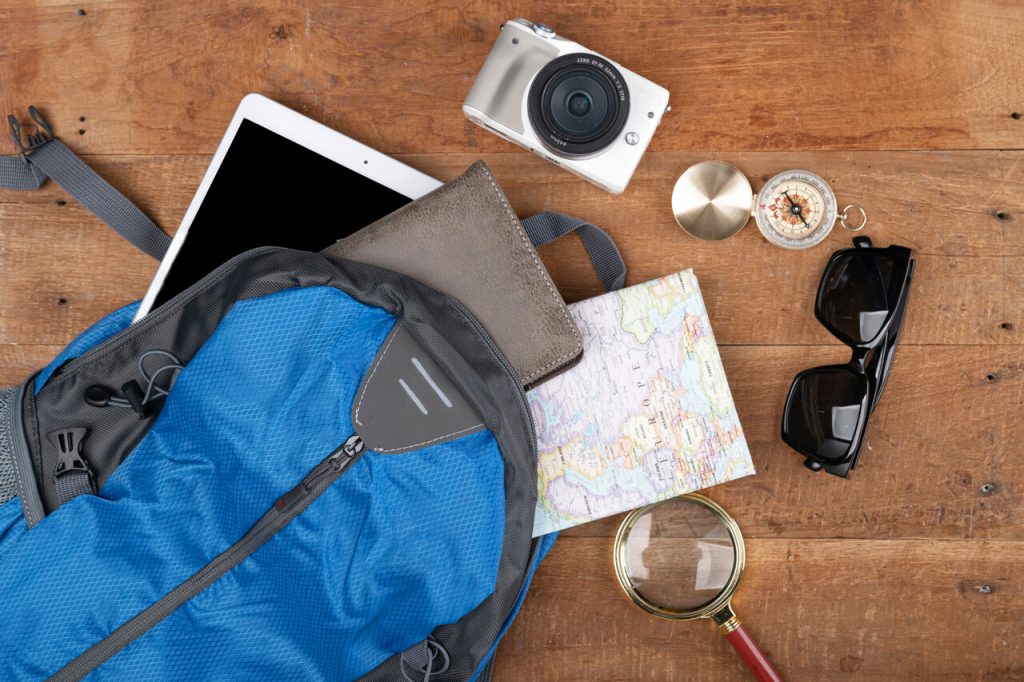 Travel concept- traveler accessories on wooden background
