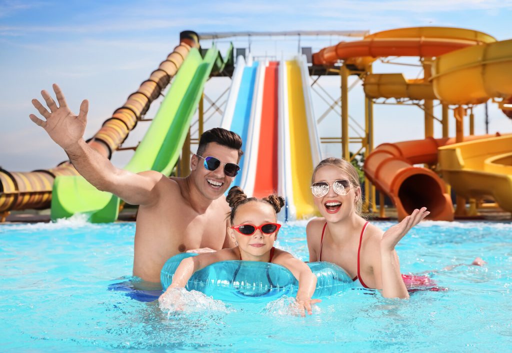 Families cooling off at a colorful water park