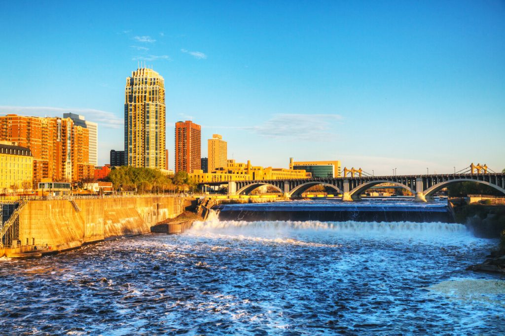 Downtown Minneapolis, Minnesota at night time as seen from the Stone Arch Bridge