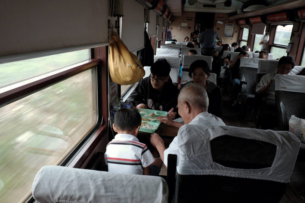 Family sharing snacks on board