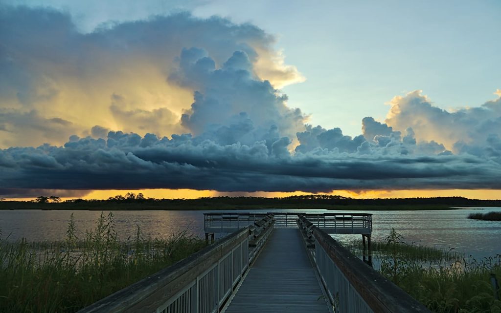 Beautiful dramatic clouds over the East River Pool pier St. Marks NWR